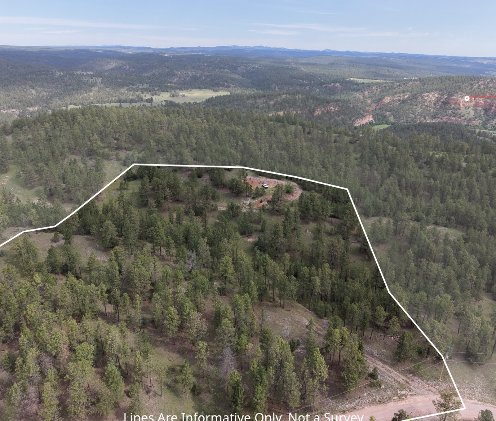 Drone photo of the Flagstone Drive property with its parcel boundary drawn on the image